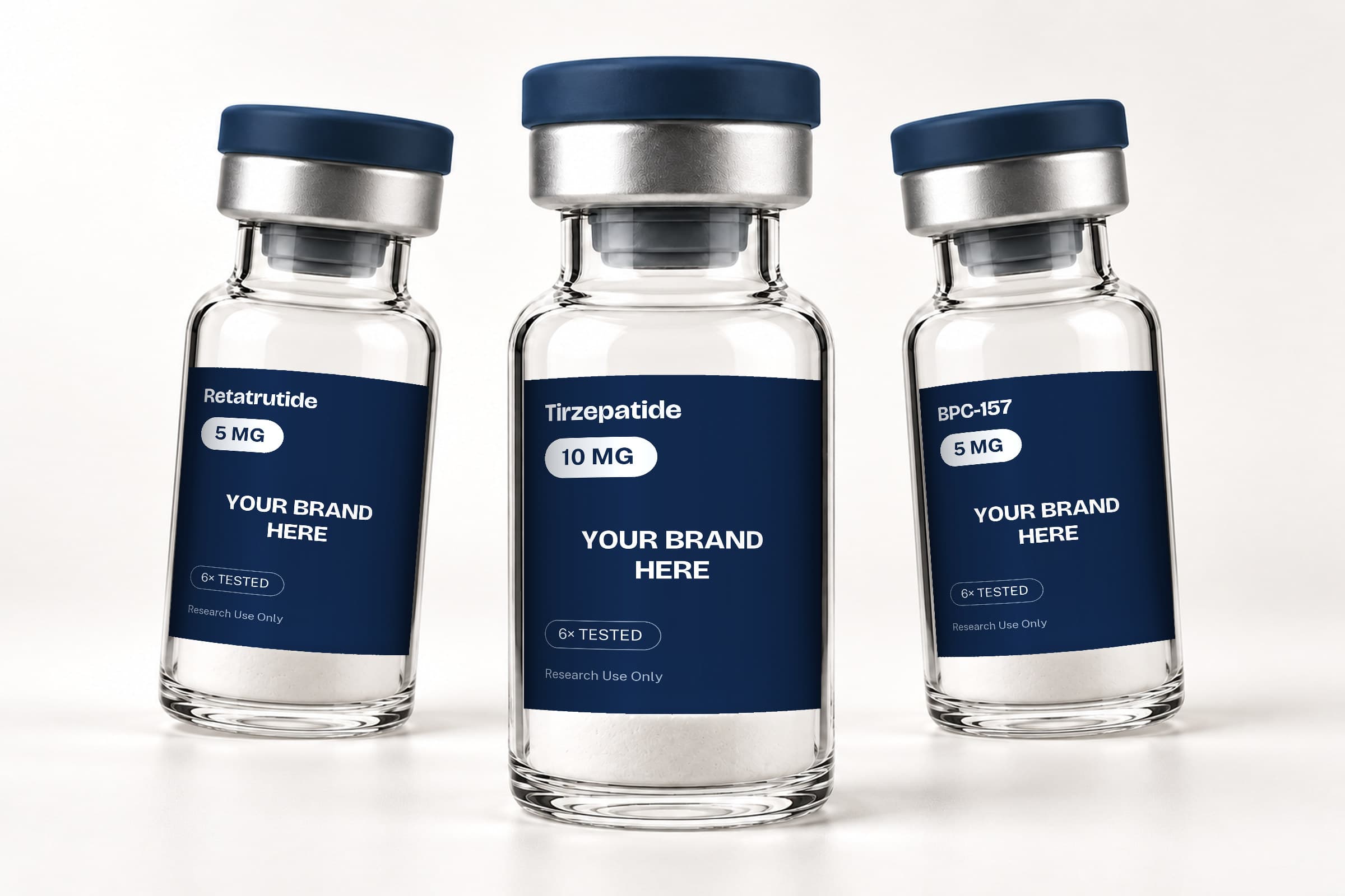 Three vials with blank navy labels reading Your Brand Here